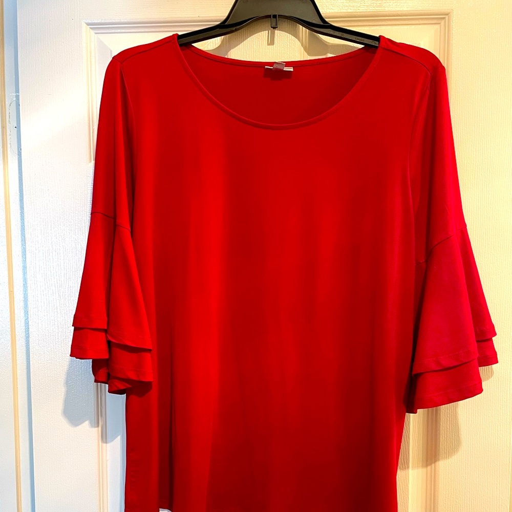 Beautiful red flowing blouse.